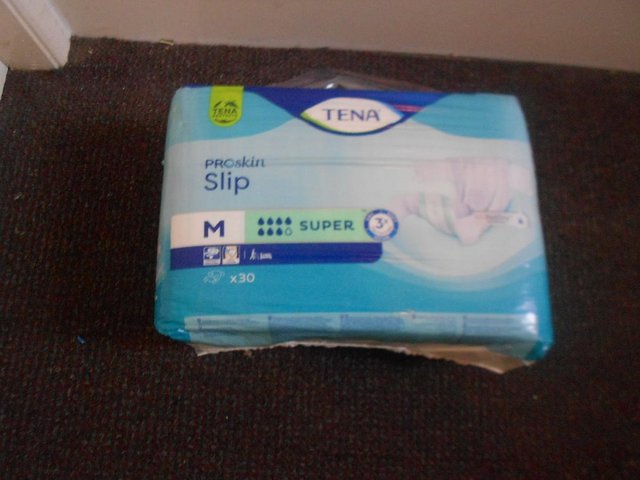 Preview of the first image of TENA ADULT UNISEX INCONTINENCE NAPPIES..