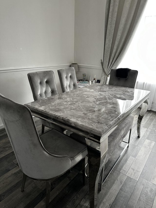 Preview of the first image of Marble table x 4 velvet chairs.
