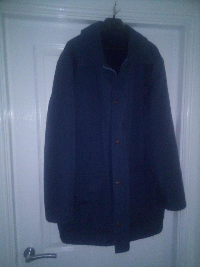 Preview of the first image of Men's winter coat - navy blue colour.