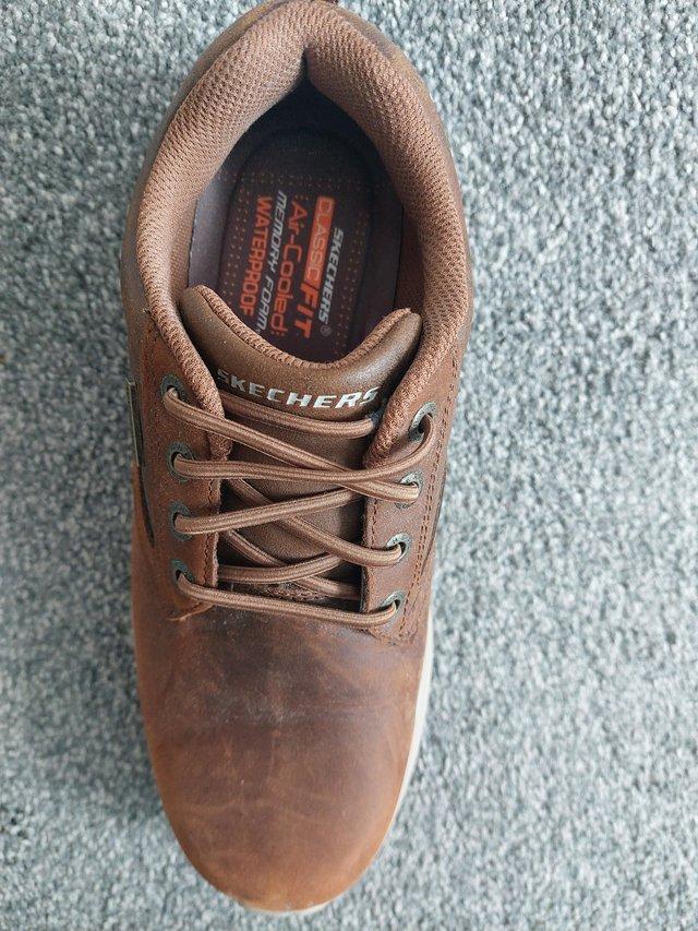 Preview of the first image of Mens Brown Size 7 Skechers Shoes.