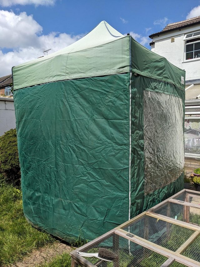 Preview of the first image of Collapsible heavy-duty gazebo with walls and storage bag.