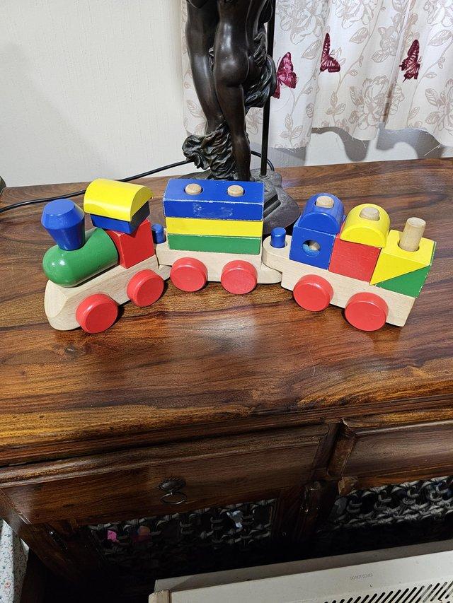 Preview of the first image of Wooden toy train with two carriages.