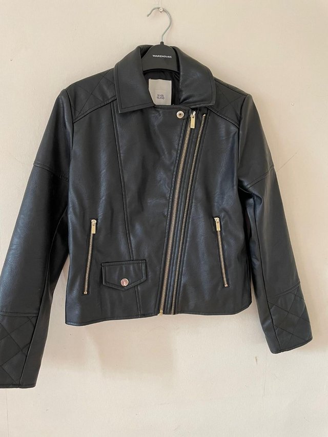 Preview of the first image of Unused Girls River Island Faux Leather Jacket.