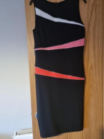 Image 1 of Tia Black Dress with orange/white with zip detail. Size 16.