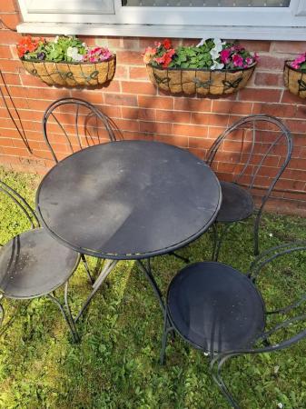 Image 1 of Heavy iron garden table with 4x chairs