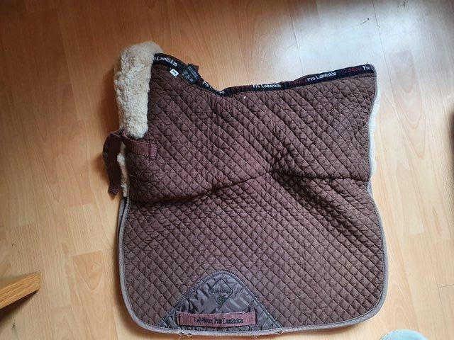 Preview of the first image of Lemieux large brown lambswool dressage pad for sale.