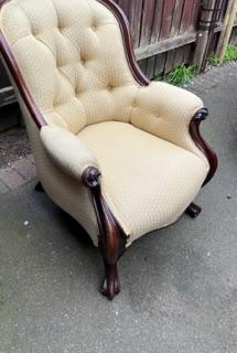 Preview of the first image of Antique nursing chair in a brown material.