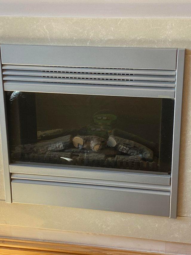 Preview of the first image of Inset electric fire which lights up.