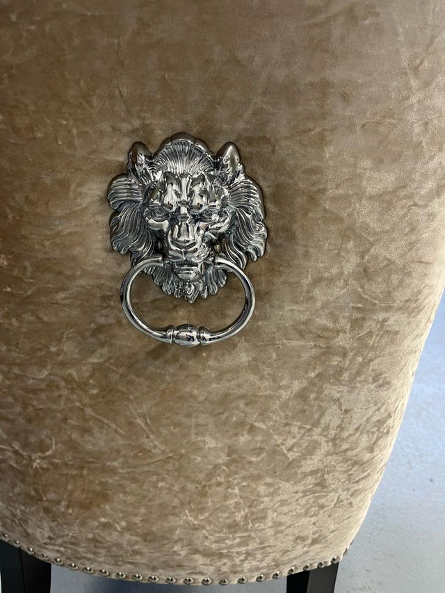 Preview of the first image of Beautiful armchair with lion head engraved.