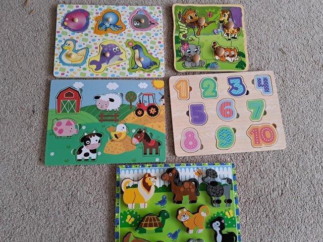 Preview of the first image of 6 coloured wooden toddler puzzles (see pics).