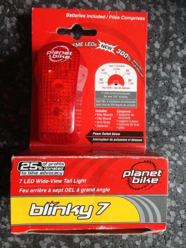 Preview of the first image of Planet Bike Blinky 7 Multi Function Rear Light.