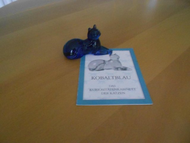 Preview of the first image of Franklin Mint cobalt blue glass cat sculpture.