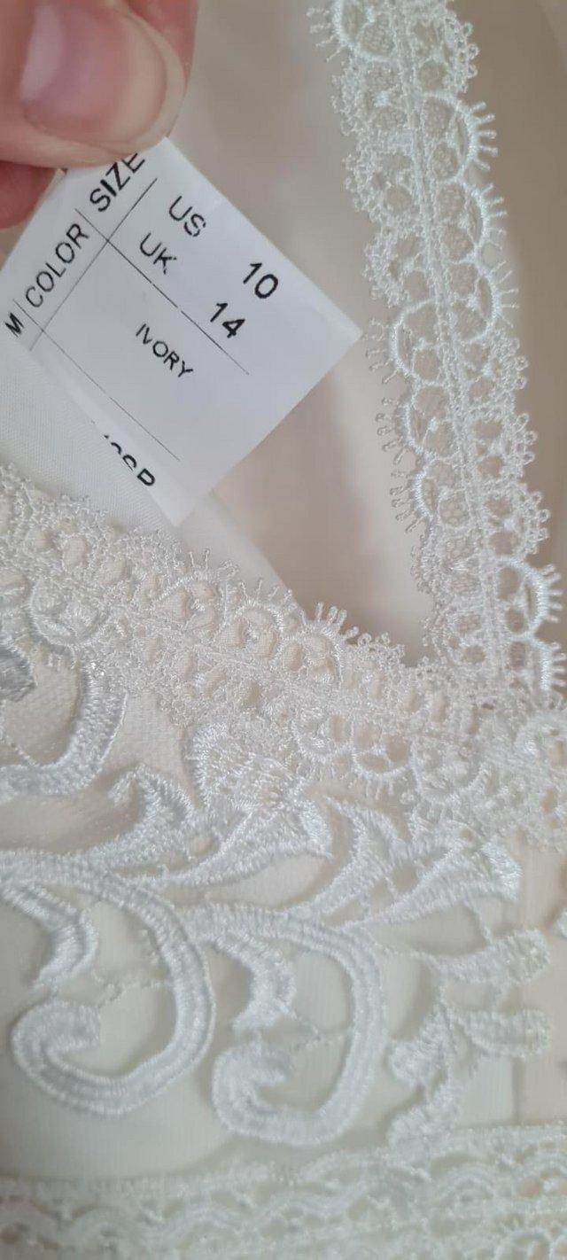 Preview of the first image of Stunning Wedding Dress New with tags.