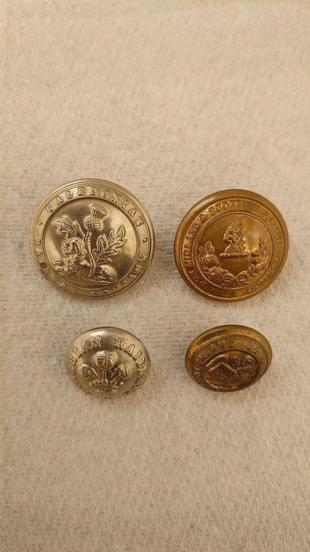 Preview of the first image of Railway buttons x4 Caley, Highland, Cambrian, LMS.
