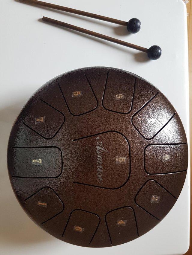 Preview of the first image of Steel Tongue Drum 11 notes 10inch with mallets.