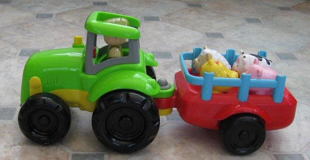 Preview of the first image of Tesco Carousel Tractor And Trailor with x 4 Farm Animals.