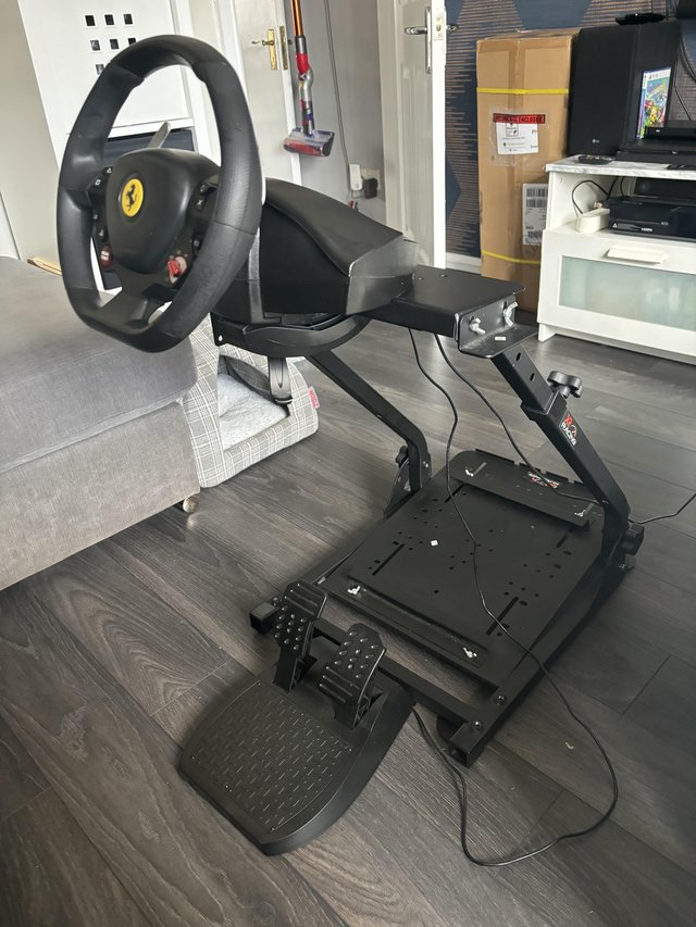 Preview of the first image of Trustmaster Ferrari steering wheel and pedals and stand.