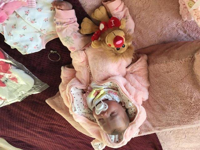Preview of the first image of Reborn baby girl doll comes with extras.