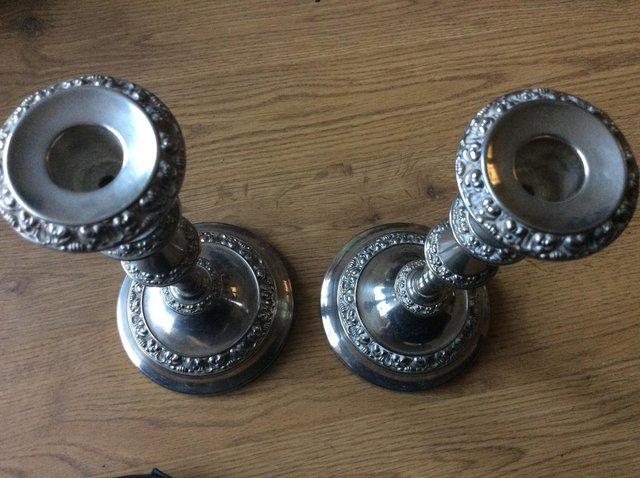 Preview of the first image of 2 silver plated candlestick holders.