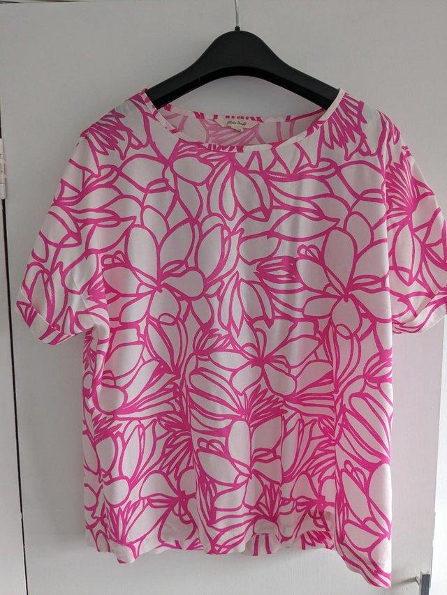 Preview of the first image of White Stuff ladies short sleeved pink/white top.