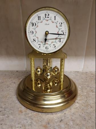 Image 2 of Anniversary clock.- Polished brass finish with acrylic dome