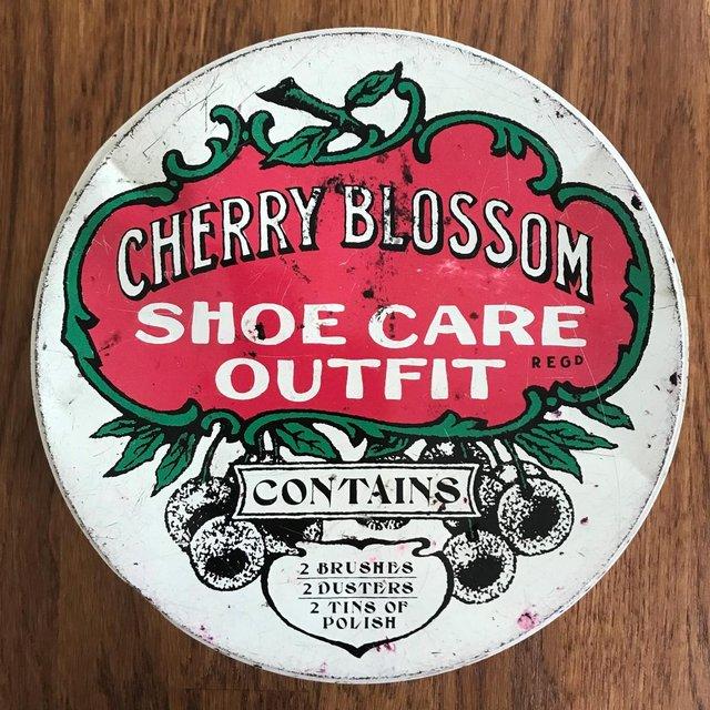 Preview of the first image of Large vintage Cherry Blossom Shoe Care Outfit tin, empty.