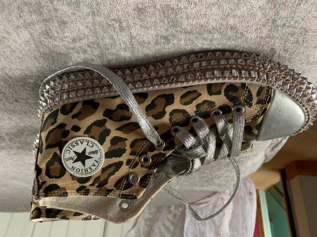 Preview of the first image of Leopard print studded trainers.