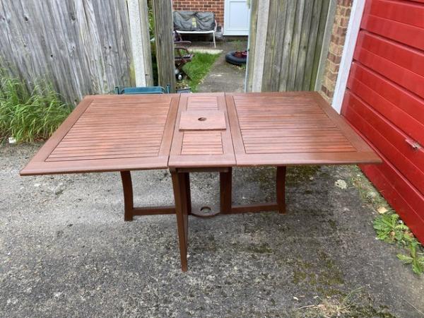 Image 3 of Solid wood folding garden table for six people.