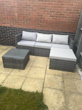 Image 1 of Corner garden sofa with cushions and side table.