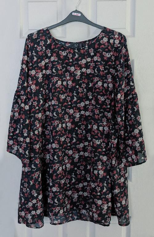 Preview of the first image of Ladies Black Flowered Dress/Top By AX Of Paris - Size 26.
