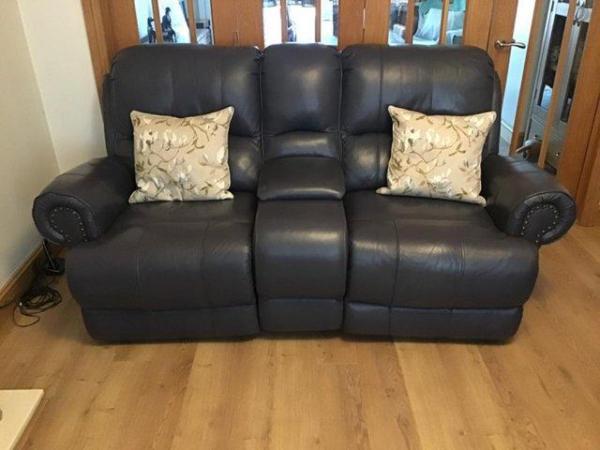 Image 1 of Leather 2 seater manual recliner with central storage space.