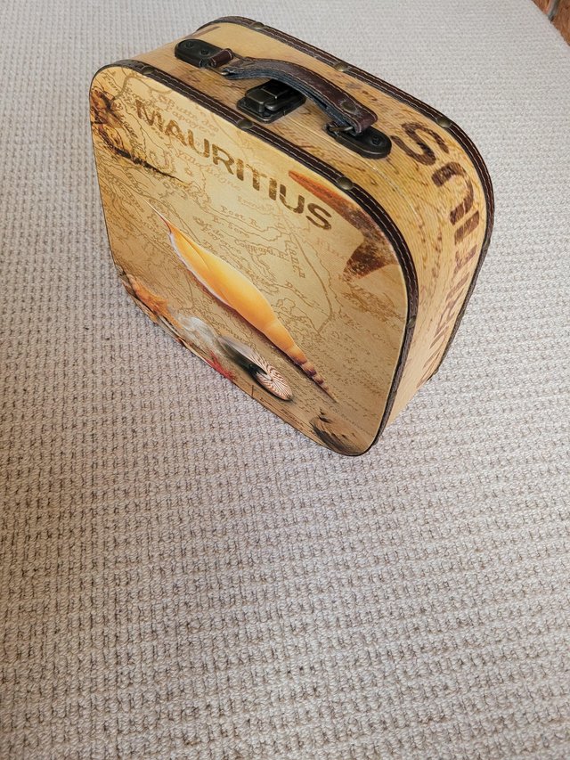 Preview of the first image of A decorative mini suitcase.