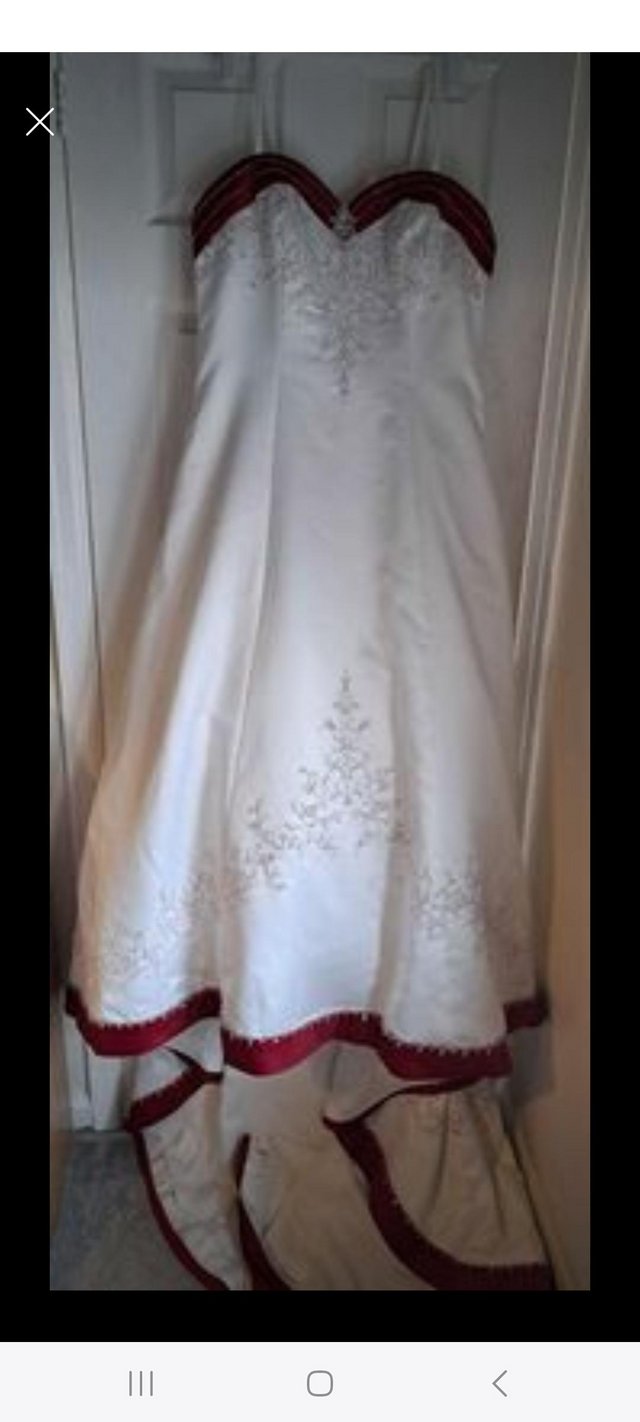Preview of the first image of Wedding Dress with Red Detail.