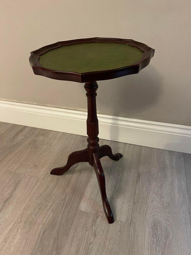 Preview of the first image of Antique style table in faux mahogany and leather.