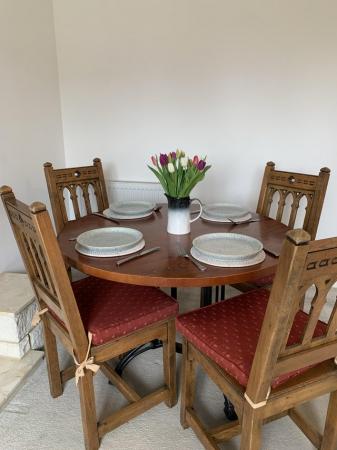 Image 1 of Solid wood, heat resistant circular table with 4 chairs