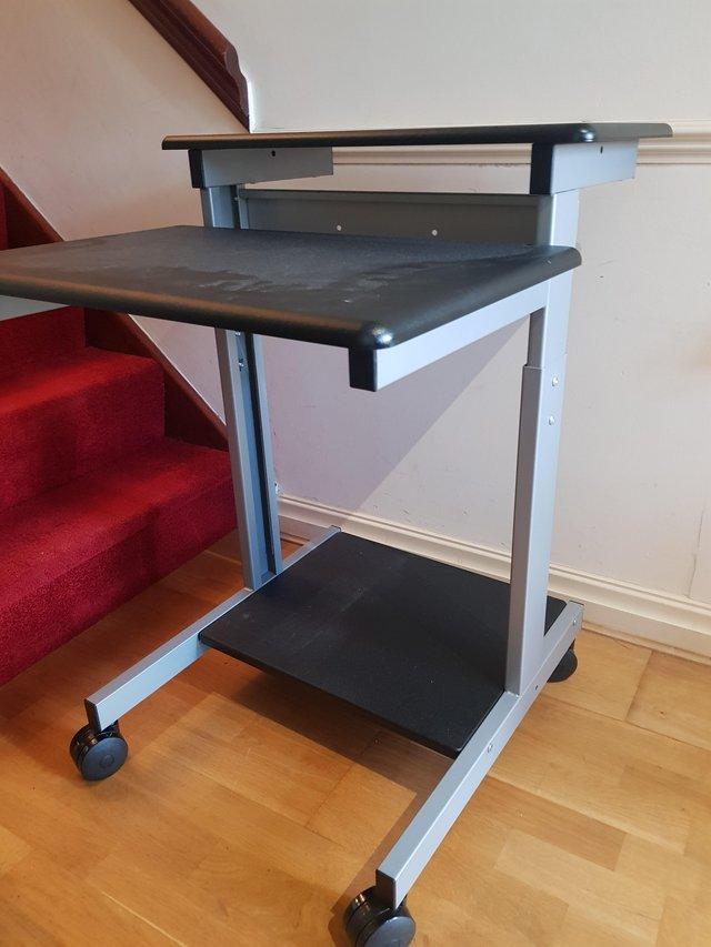 Preview of the first image of Two tier, sit-stand, adjustable stand.