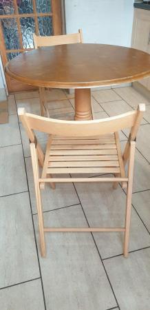 Image 1 of Compact round dining table and chairs