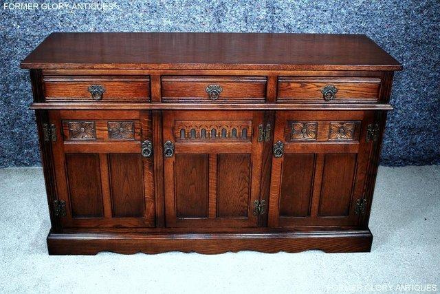 Preview of the first image of AN OLD CHARM TUDOR BROWN OAK SIDEBOARD DRESSER BASE CABINET.