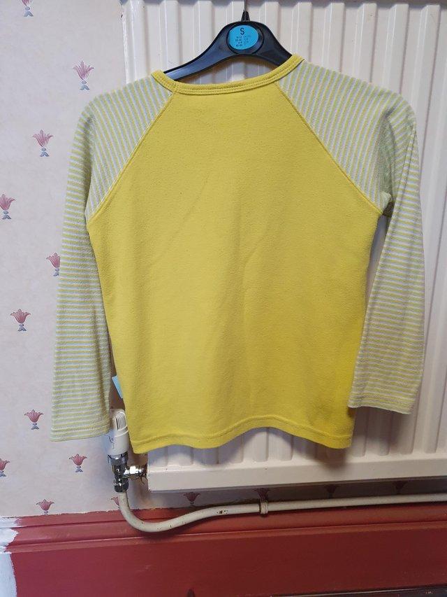 Preview of the first image of Girls Brownie uniform yellow long sleeve T shirt..