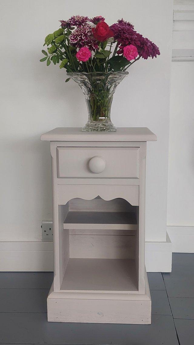 Preview of the first image of Solid pine bedside table painted in Frenchic paint.