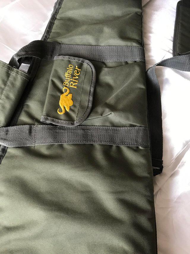 Preview of the first image of Padded carry case/ sling in green.