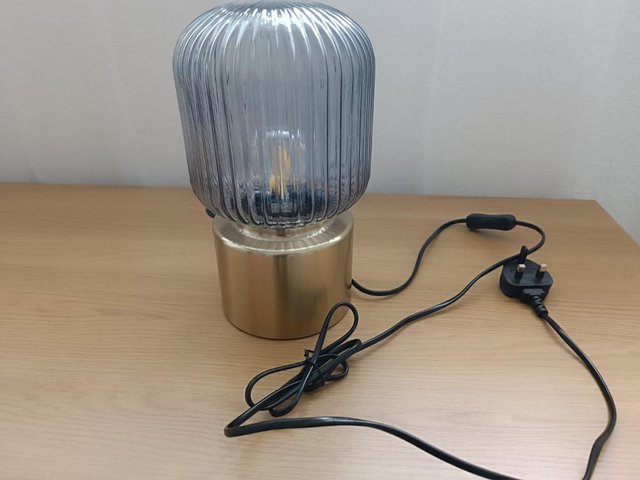Preview of the first image of SOLKLINT Table lamp, brass/grey clear glass, 28 cm.