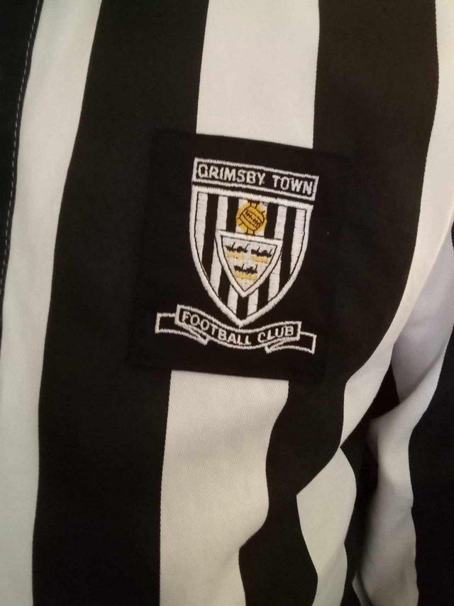 Preview of the first image of Retro grimsby town football shirt.
