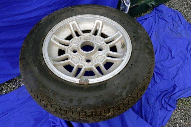 Preview of the first image of Ford Capri Mk3 Alloy wheel and tyre 13" 1980.