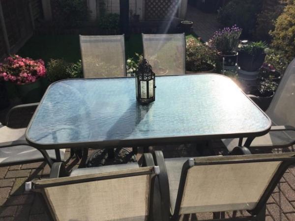 Image 1 of Glass table and 6 chairs good condition