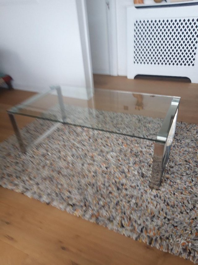 Preview of the first image of Coffee Table Glass top with crome ends.