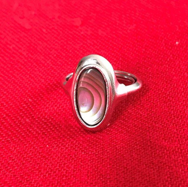 Preview of the first image of Vintage Avon silvertone ring, large oval of abalone shell..