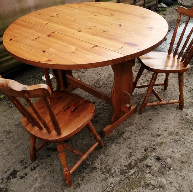 Preview of the first image of Pine farmhouse dropleaf table and 2 chairs.