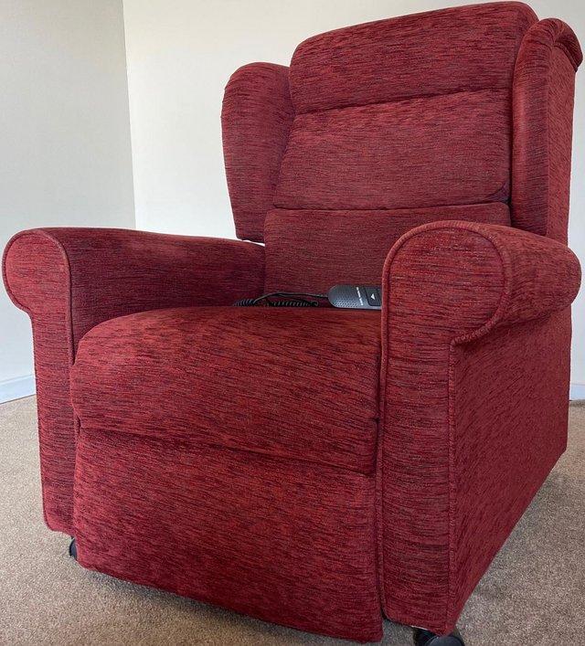 Preview of the first image of LUXURY ELECTRIC RISER RECLINER RED WINE CHAIR ~ CAN DELIVER.
