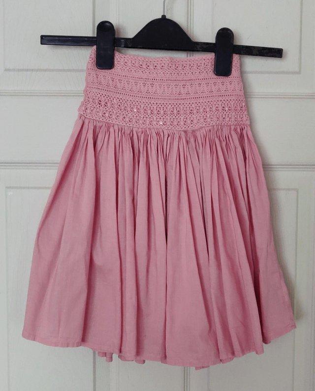 Preview of the first image of Lovely Girls Pink Skirt By Next - Age 5 Years.